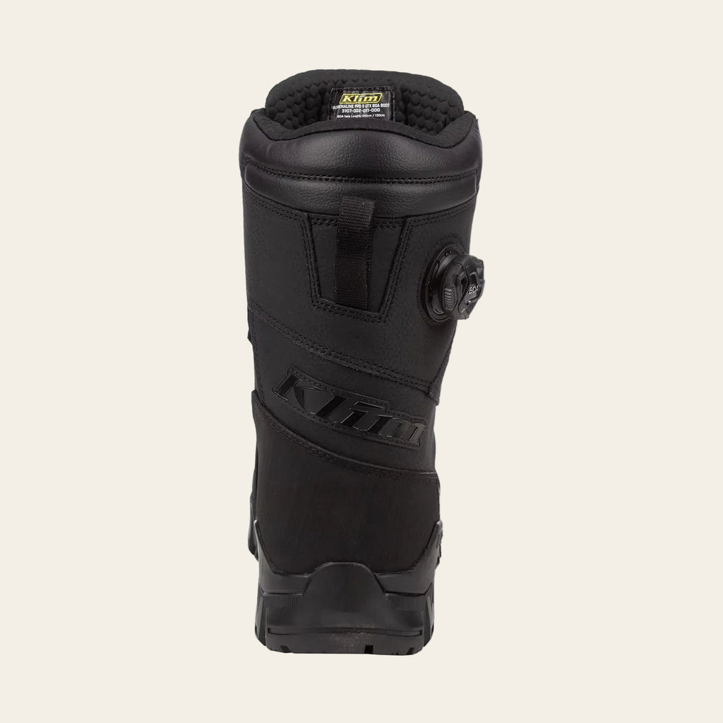 A single black Klim snowboard boot shown from the back, featuring a dial closure system and the Klim logo embossed on the side, set against a plain white background.