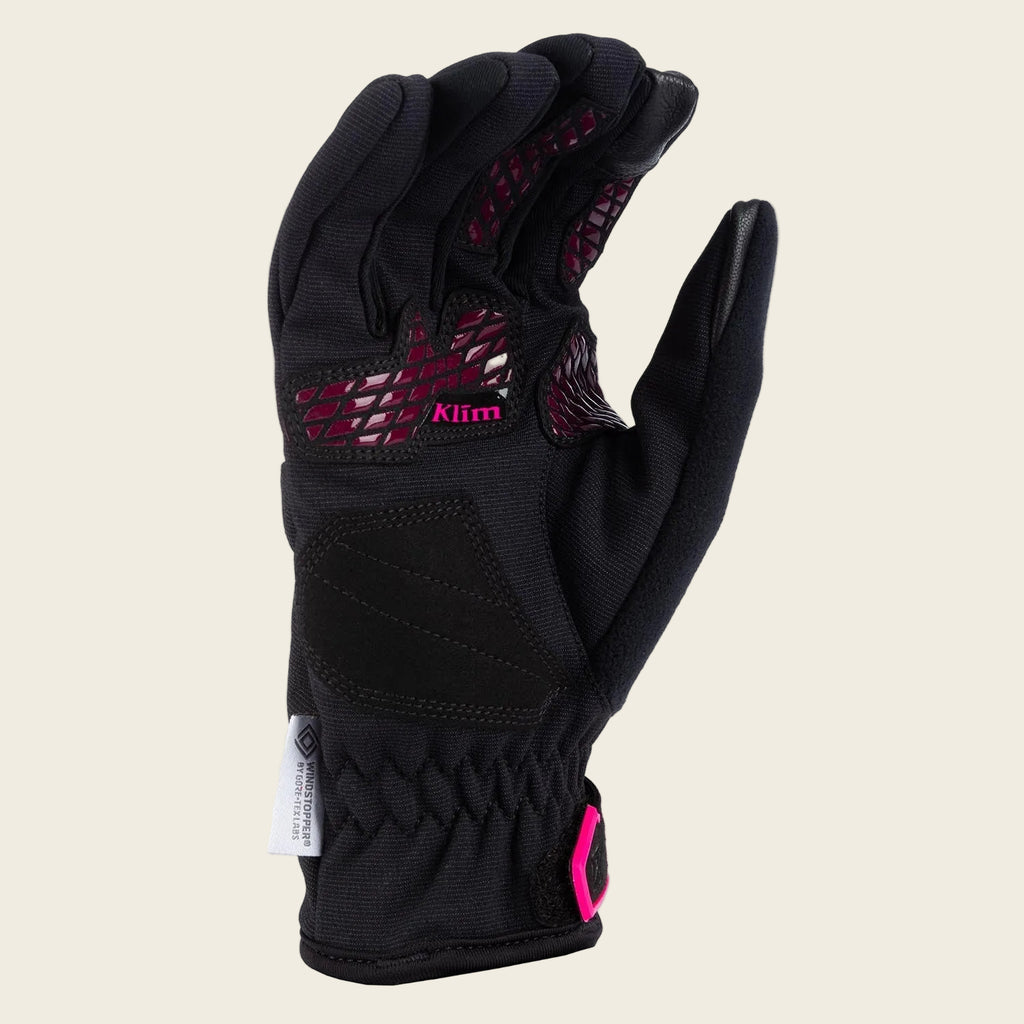 Black glove with pink accents and Klim logo on a white background