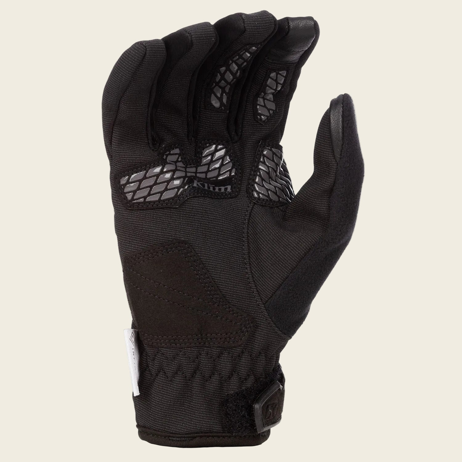 Black glove with textured palm on a white background