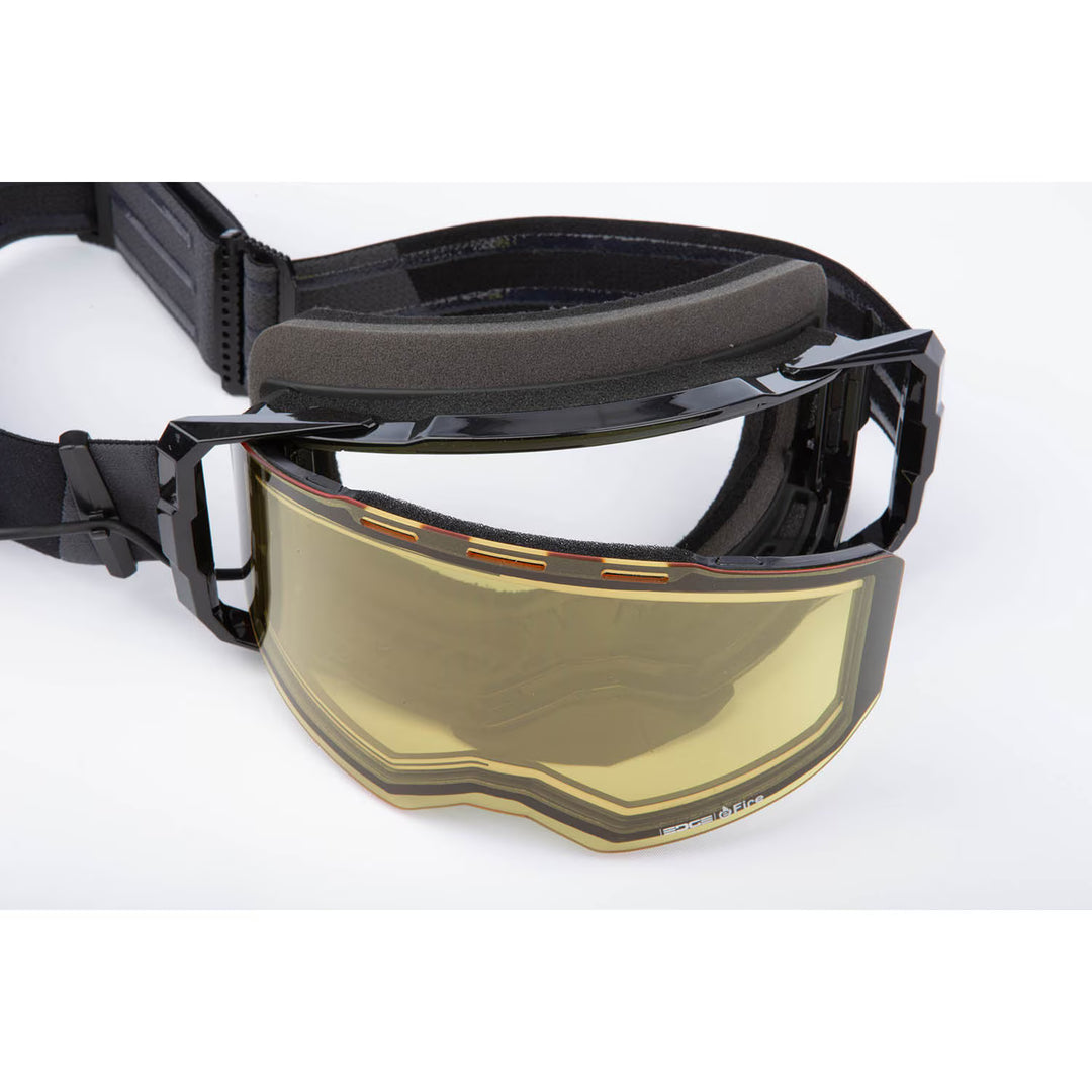Black goggles with a gold visor on a white background