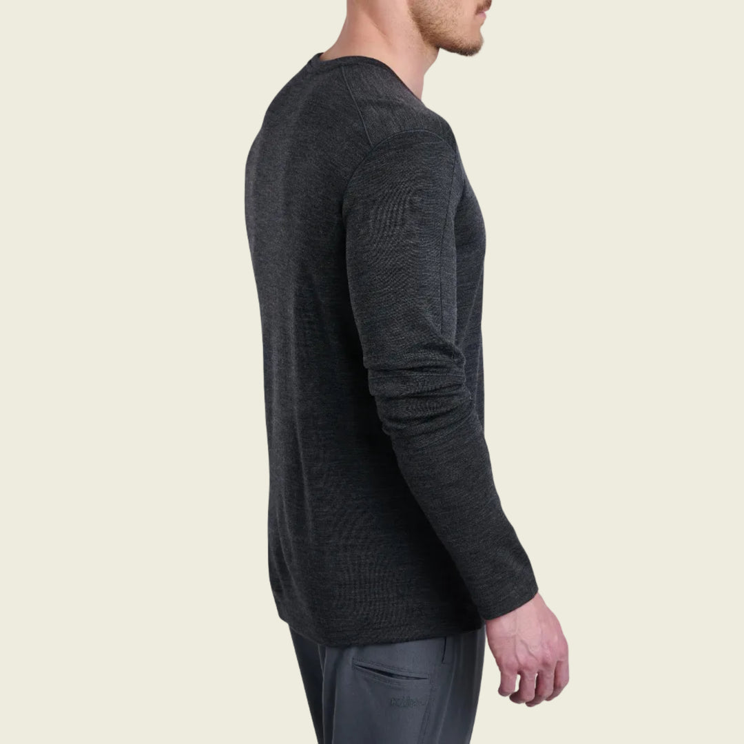 Man wearing a dark gray long-sleeve shirt on a white background