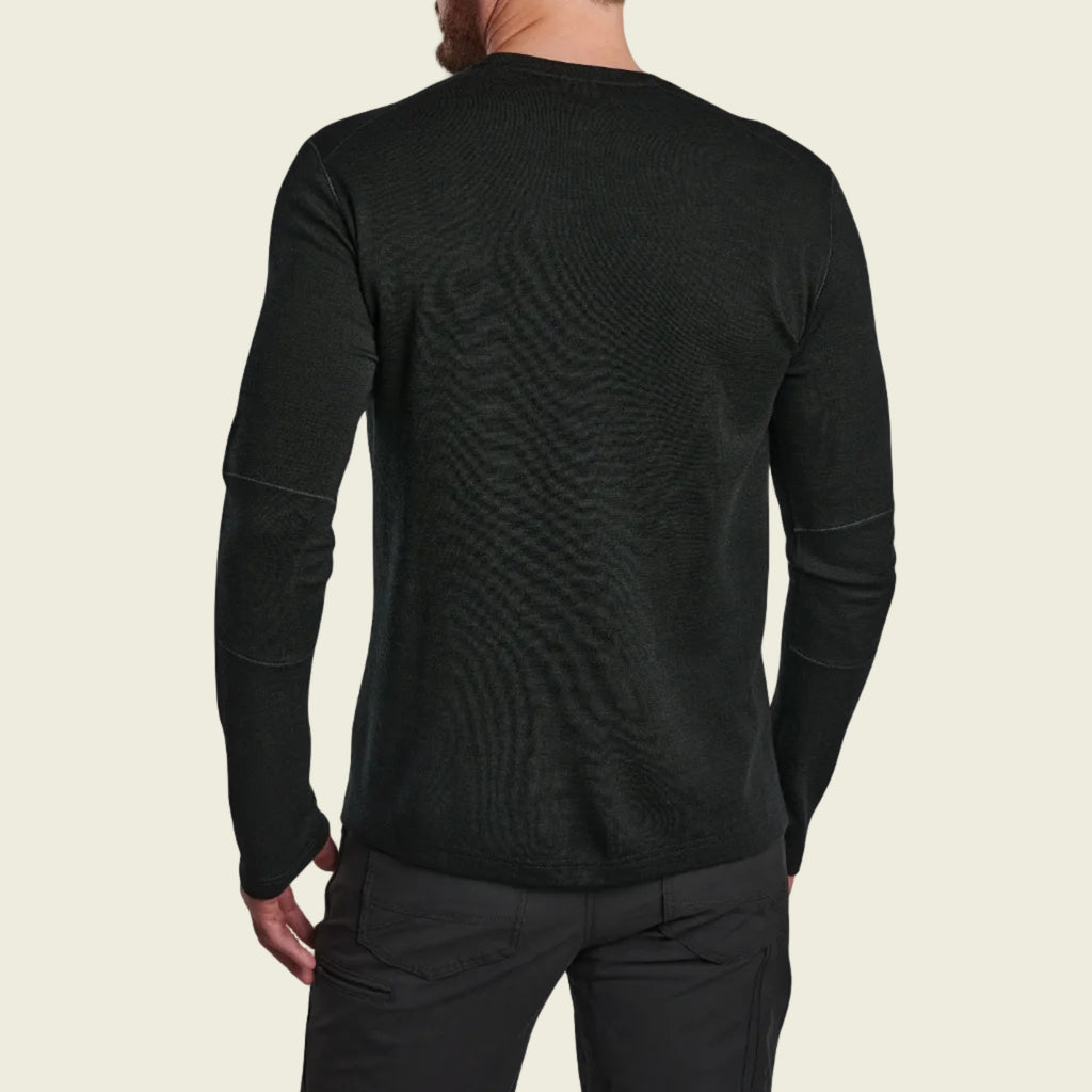Black long-sleeve shirt worn by a person on a white background