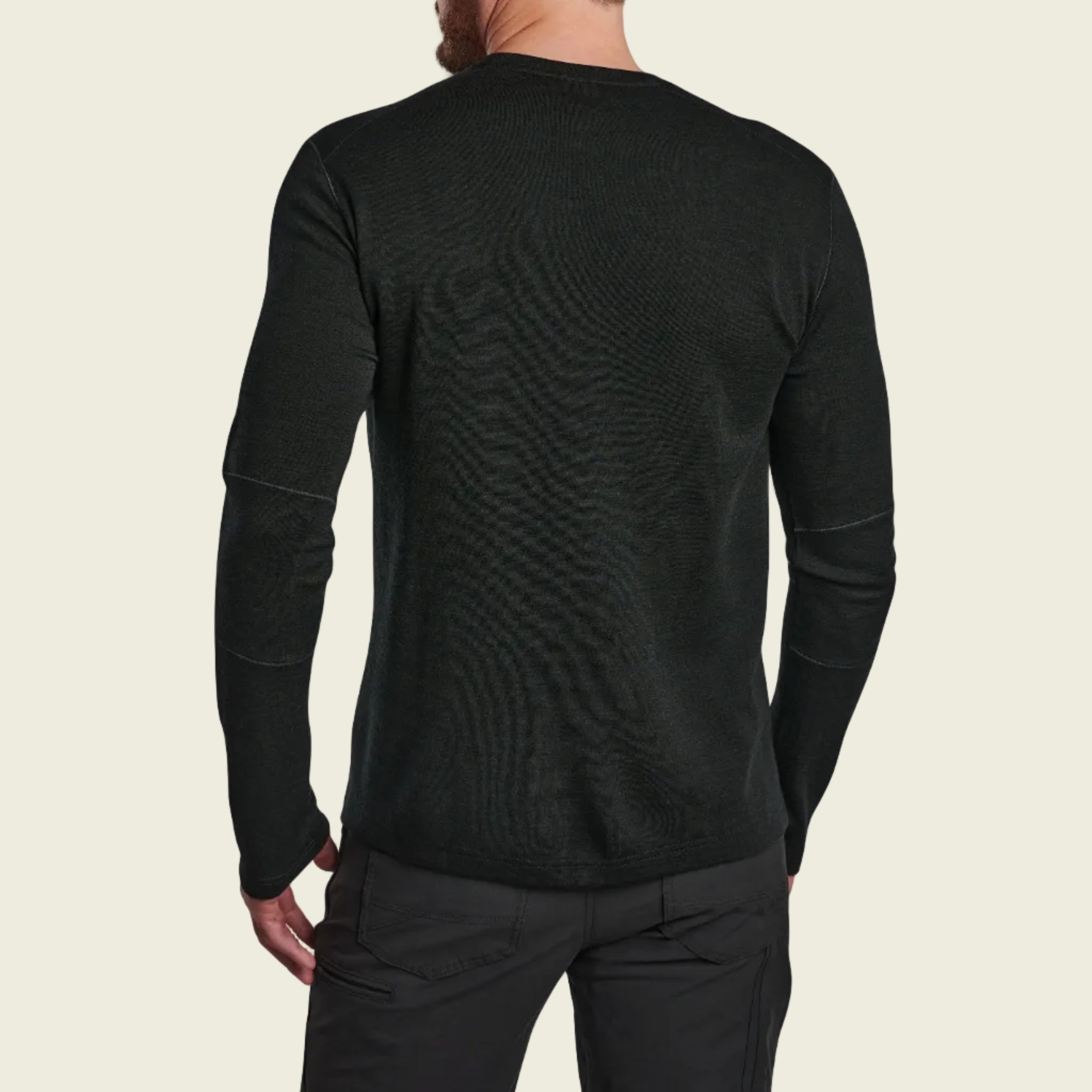 Black long-sleeve shirt worn by a person on a white background