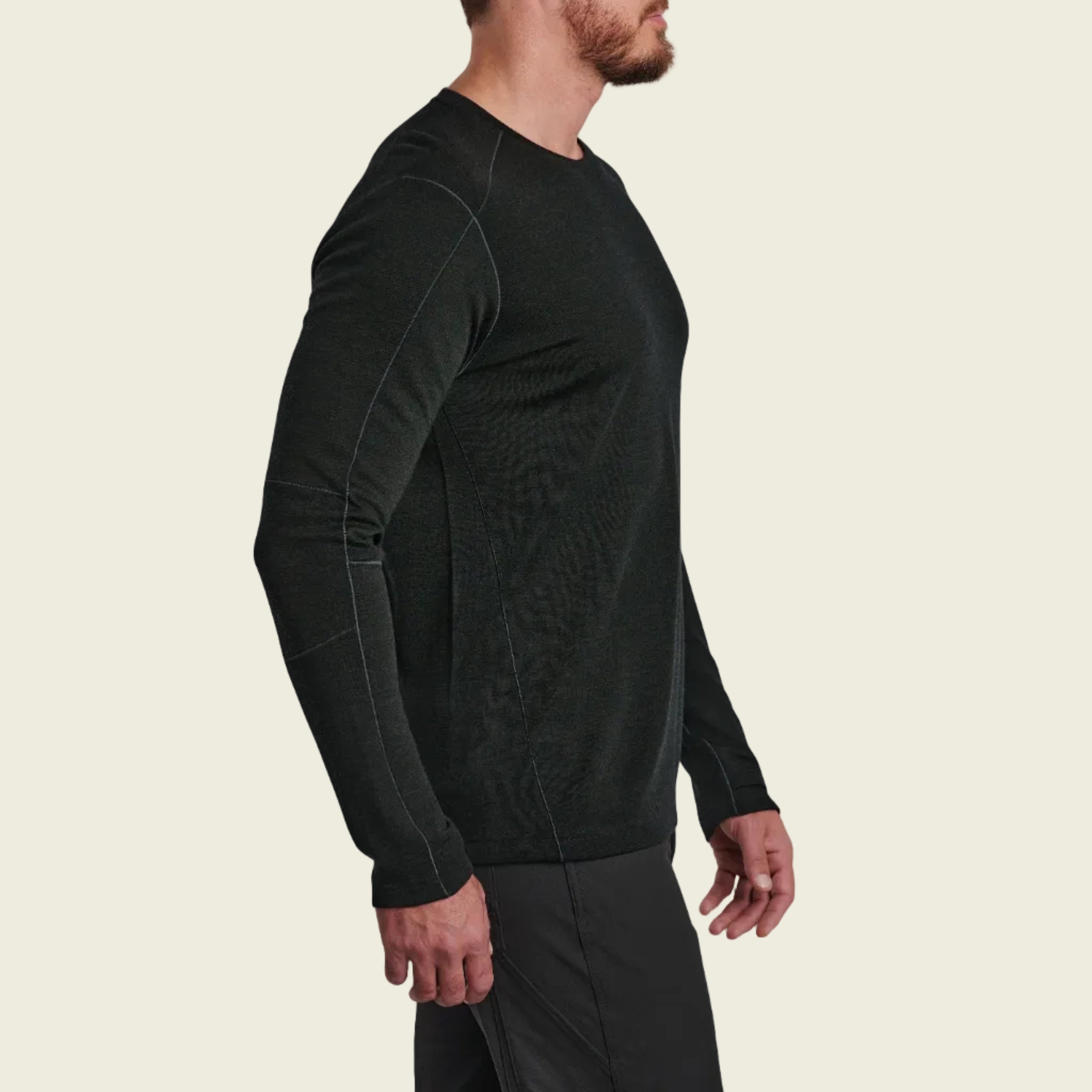 Person wearing a black long-sleeve athletic shirt on a white background