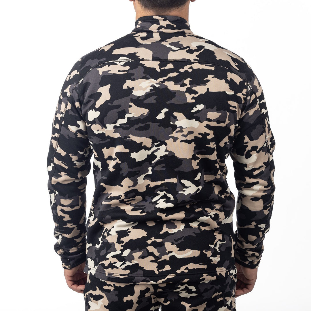 Camouflage-patterned shirt worn by a person on a white background