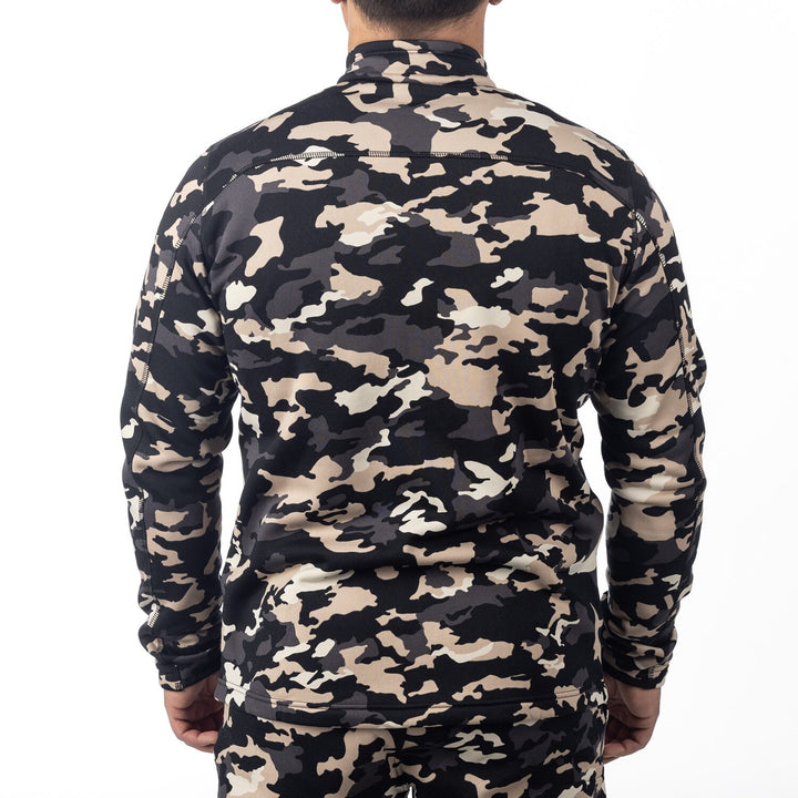 Camouflage-patterned shirt worn by a person on a white background