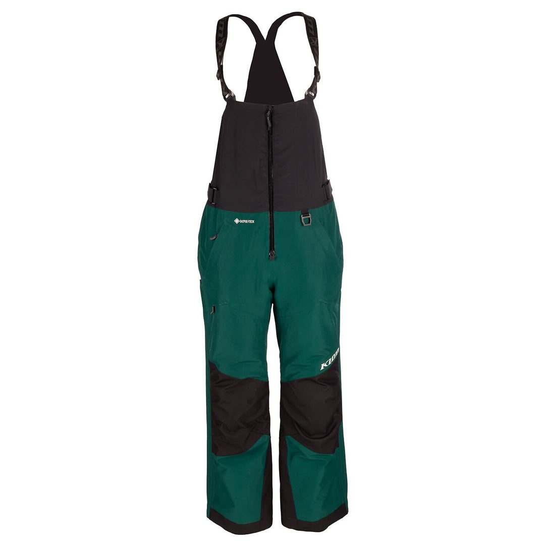 Green and black bib overalls on a white background
