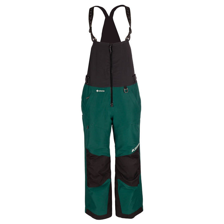 Green and black bib overalls on a white background