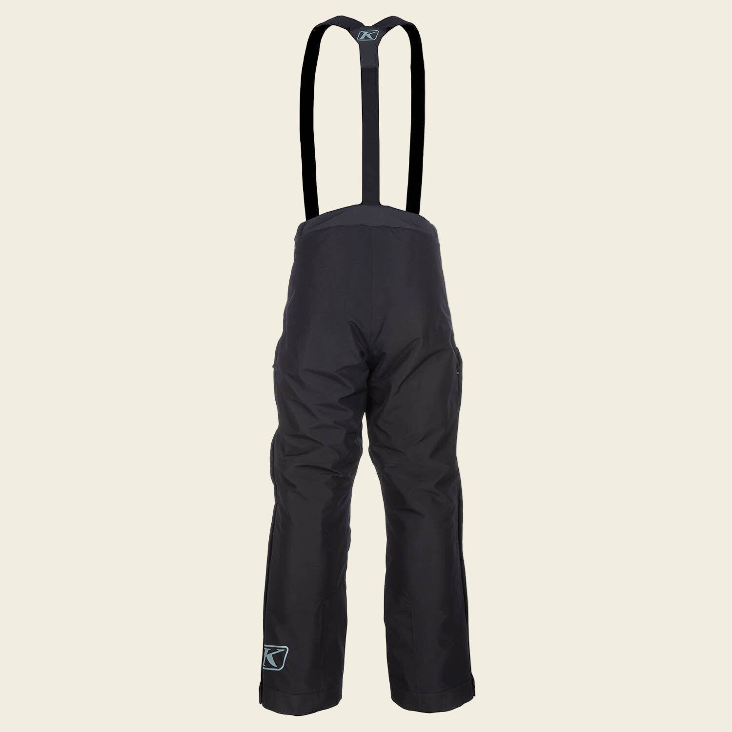 Black snow pants with suspenders on a white background
