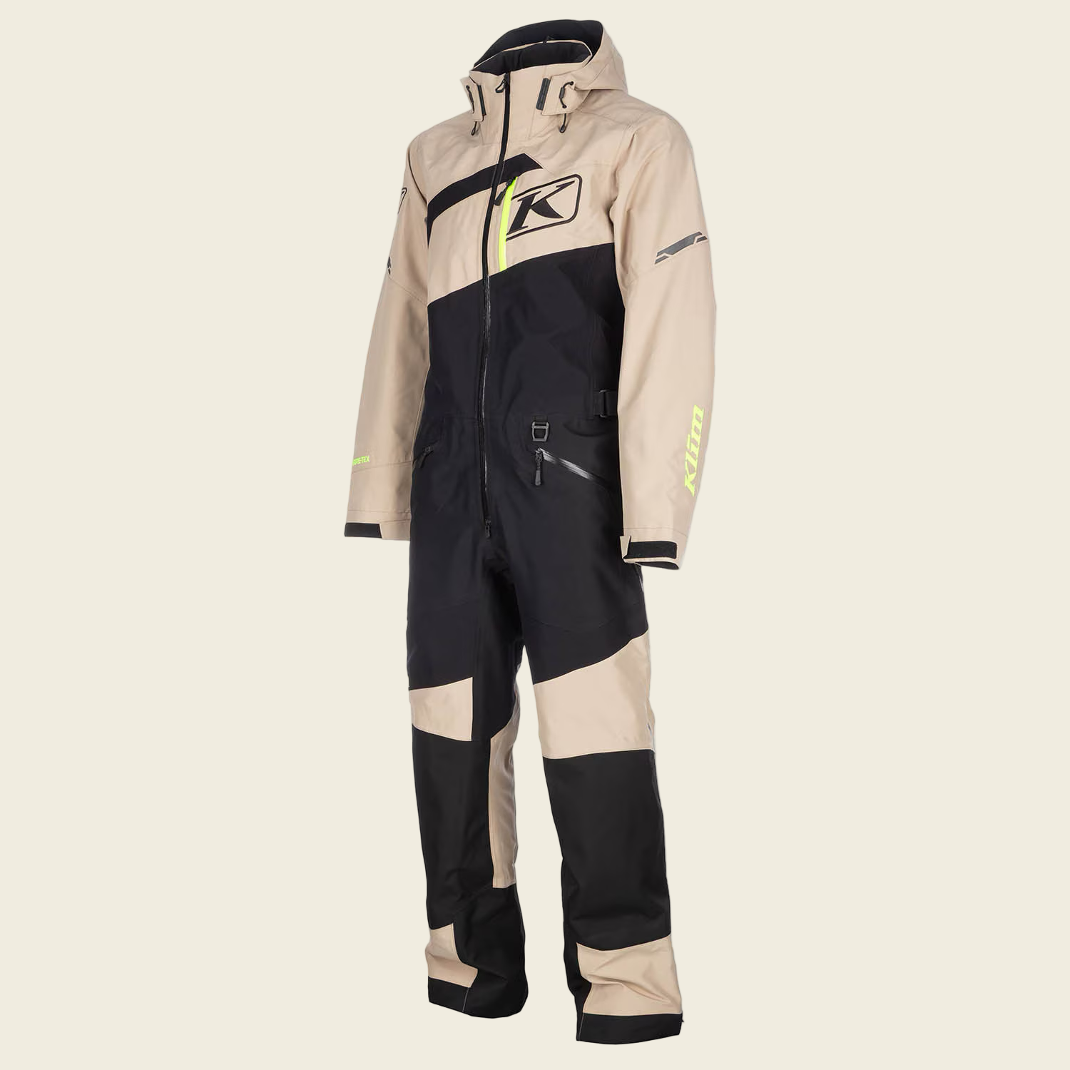 Beige and black snowmobile suit with Klim logo on a white background