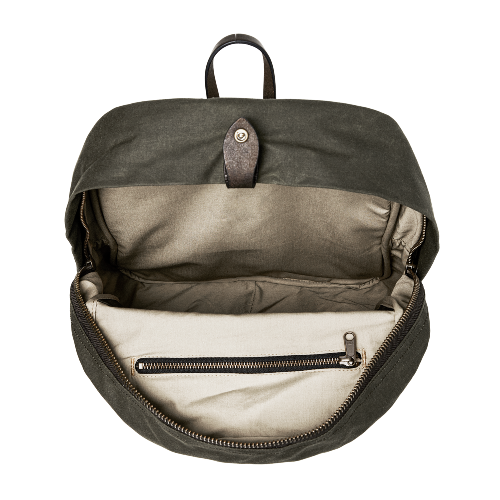 Open green backpack with interior details on a white background