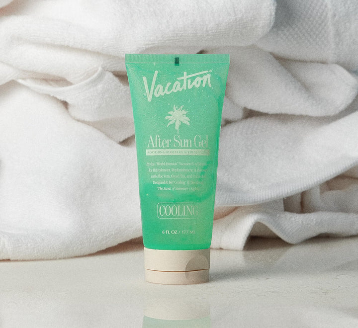 Tube of 'Vacation' after sun gel on a white towel background
