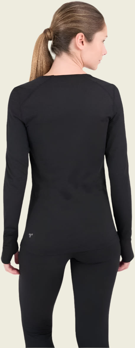 Person wearing a black long-sleeve top and black pants on a white background