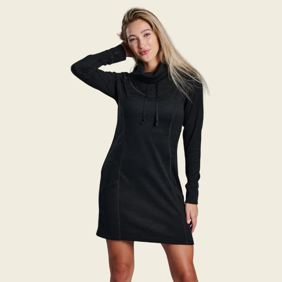 Woman wearing a black long-sleeve dress on a white background