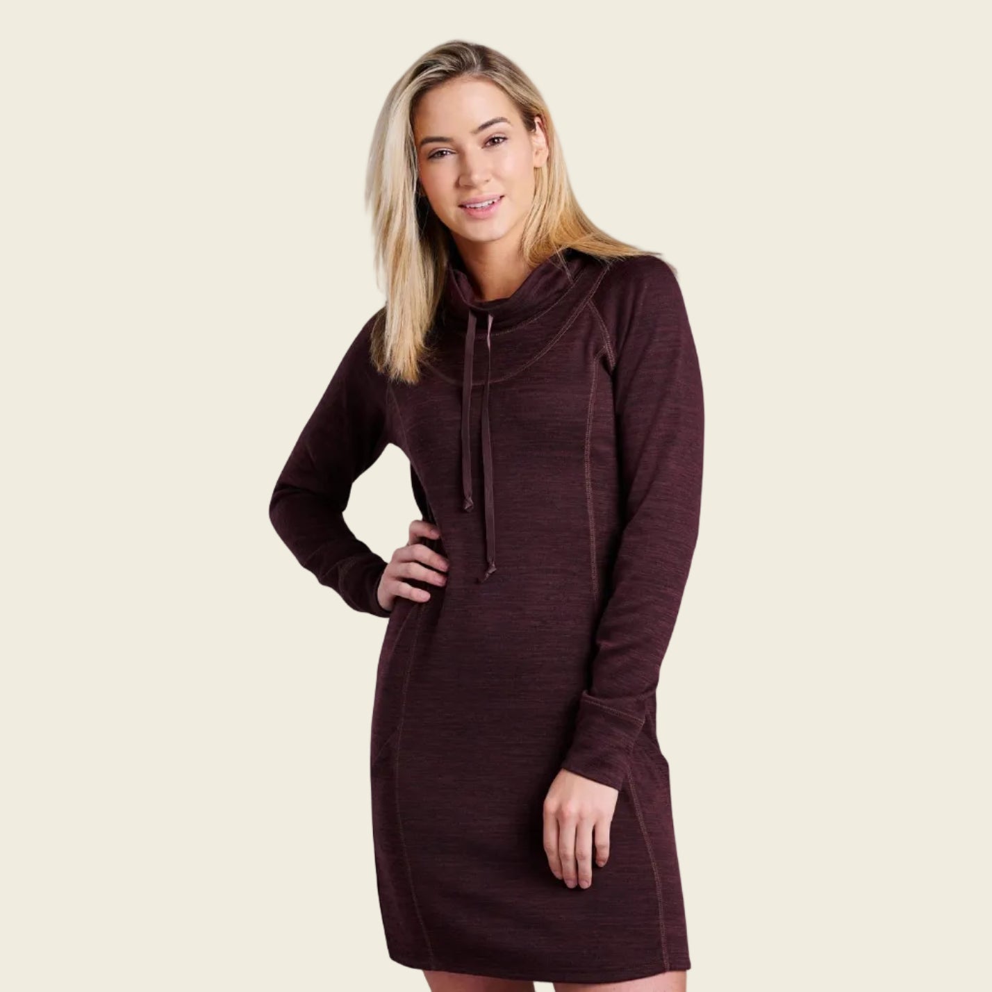 Woman wearing a brown hooded dress on a white background