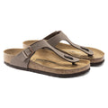 Pair of brown Birkenstock sandals on a white background