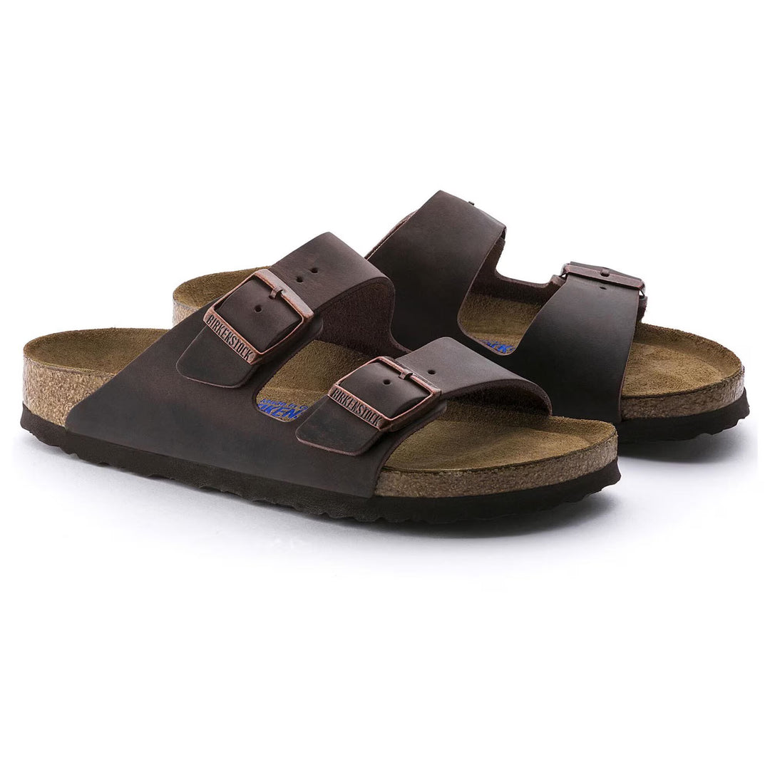Pair of brown sandals with cork insole on a white background