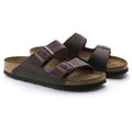 Pair of brown sandals with cork insole on a white background