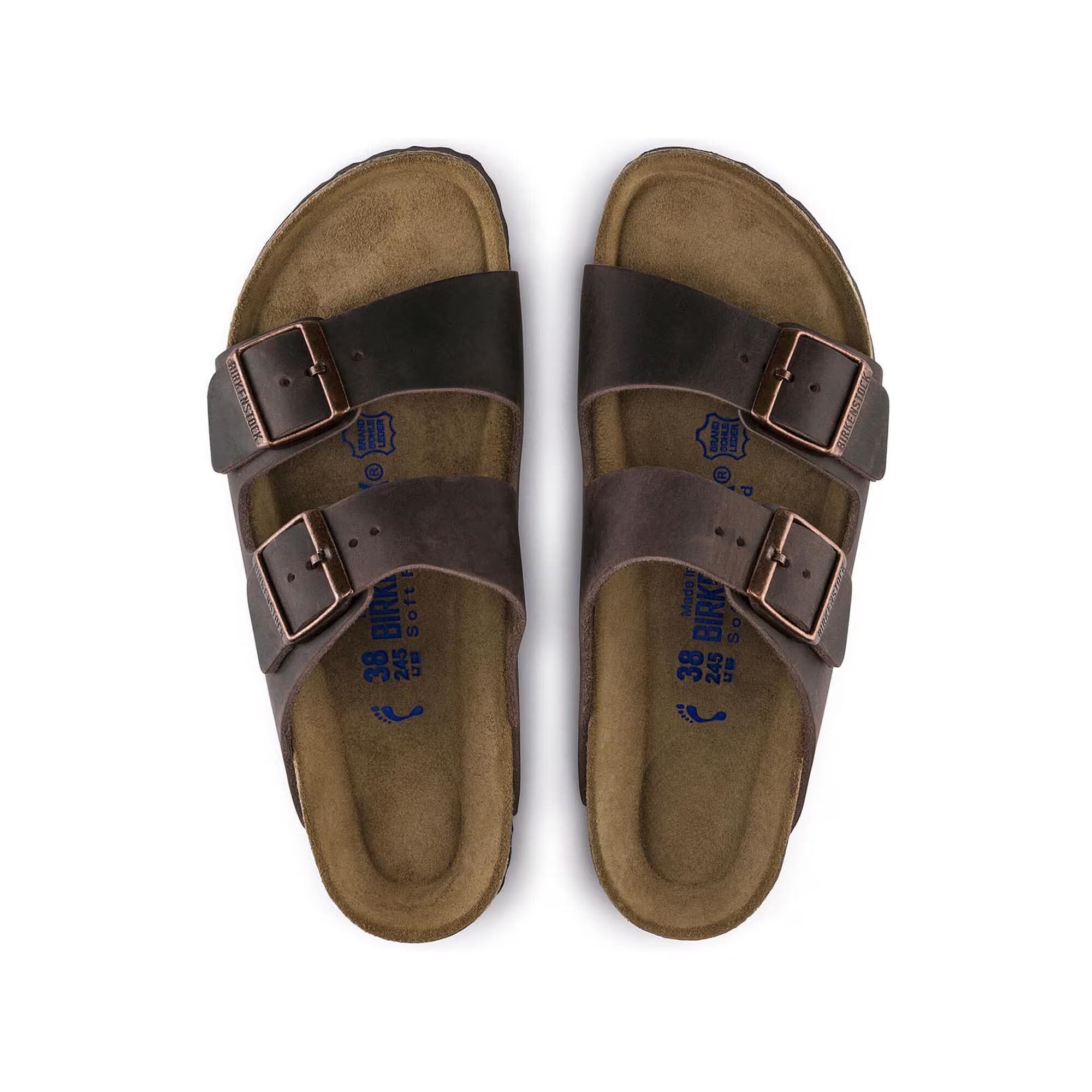 Pair of brown sandals with double buckles on a white background