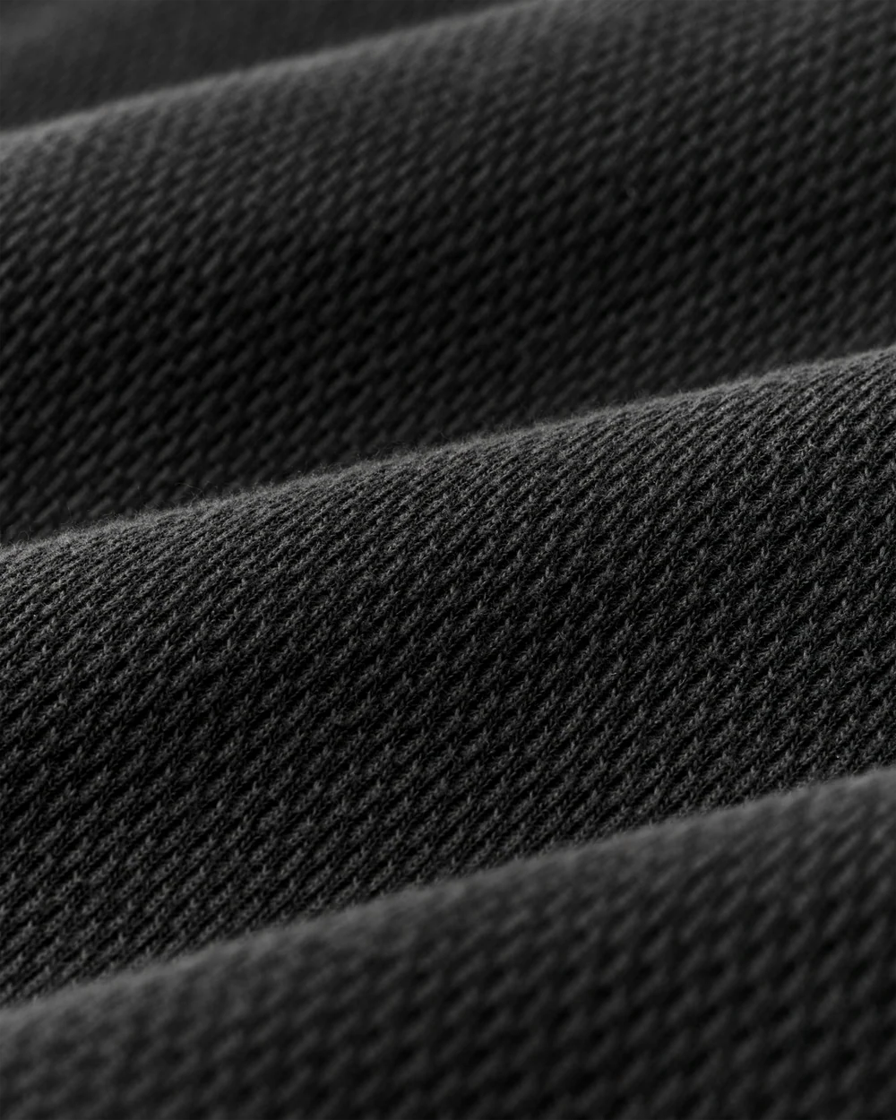 Close-up of dark gray fabric with a textured pattern