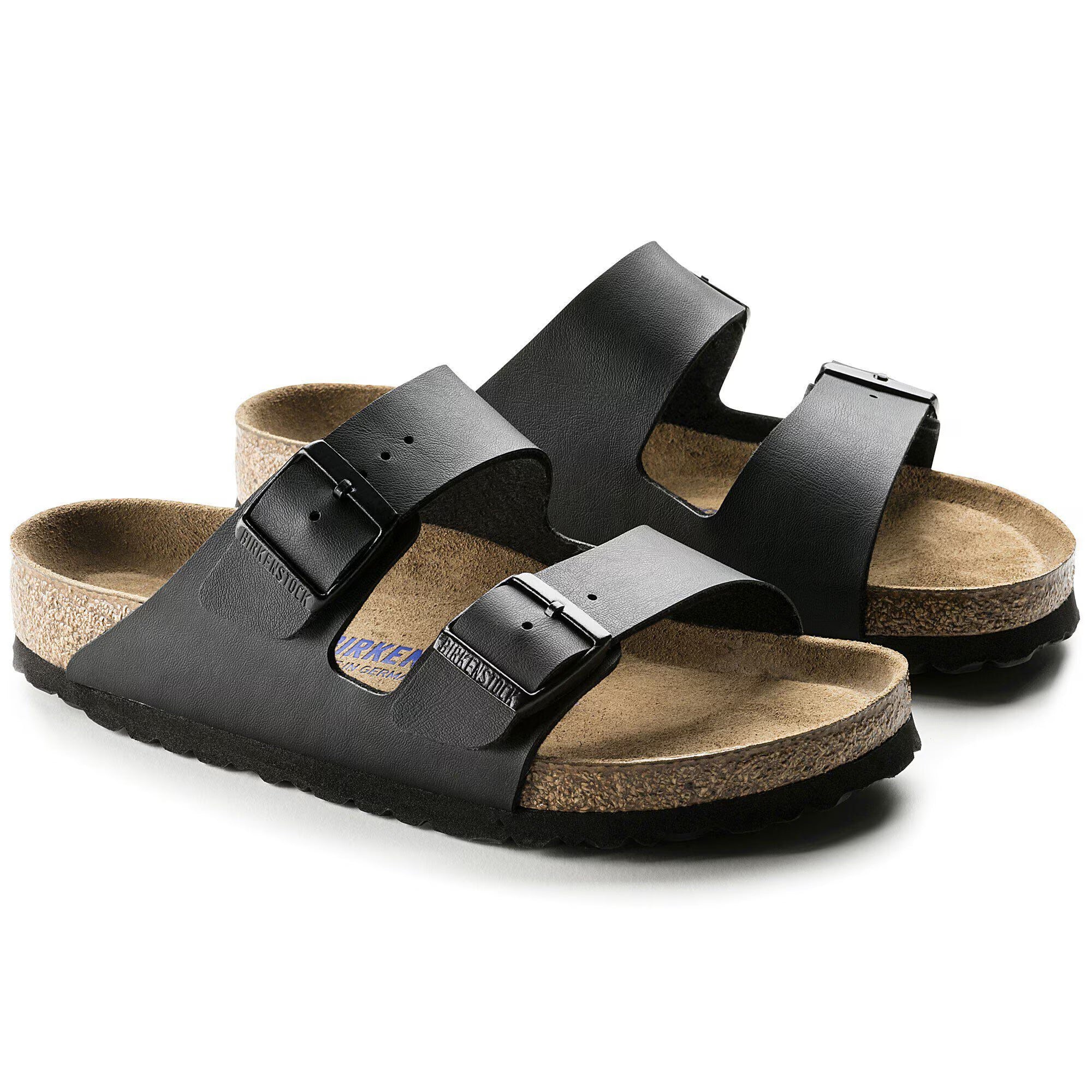 Black sandals with cork insole on a white background