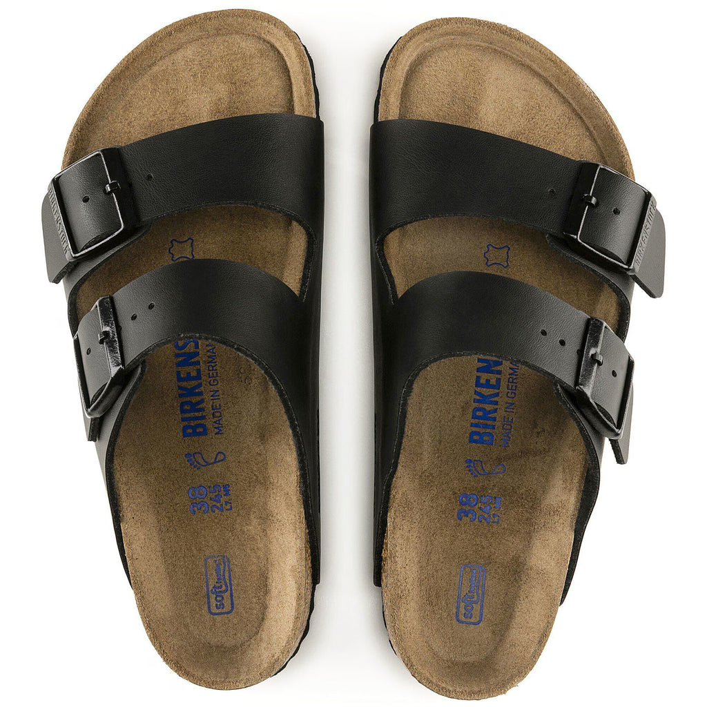 Pair of Birkenstock sandals with black straps on a white background