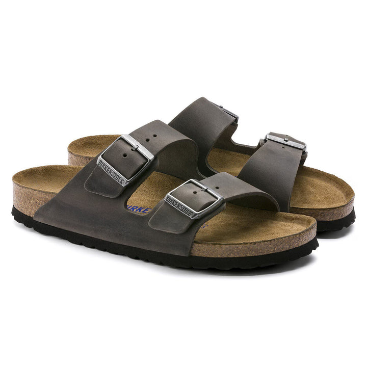 Pair of brown sandals with cork soles on a white background