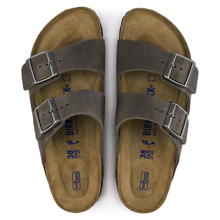 Pair of brown sandals with buckles on a white background