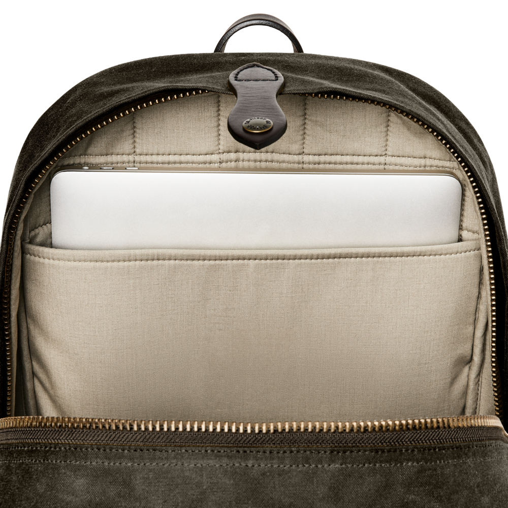 Backpack with a compartment containing a white laptop on a white background