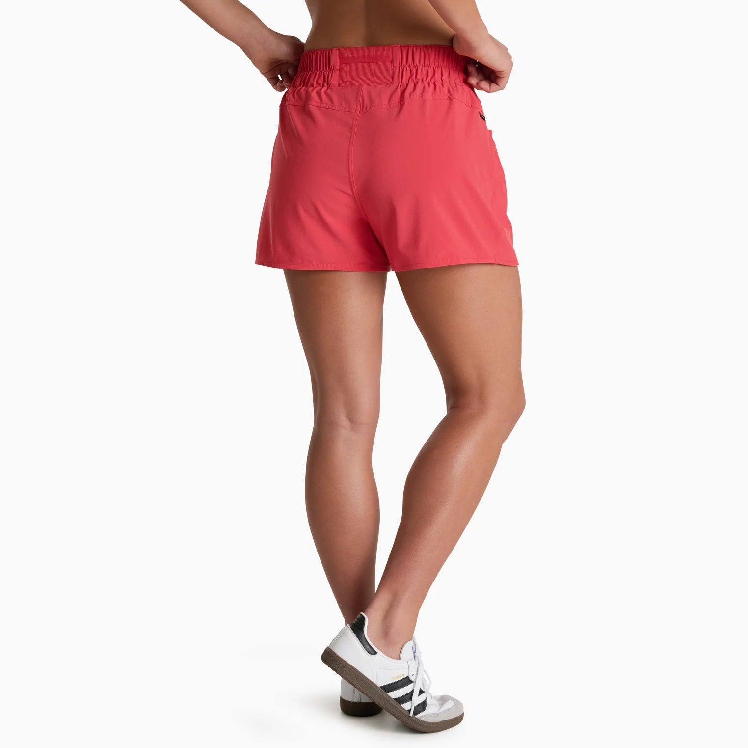 Person wearing red shorts on a white background