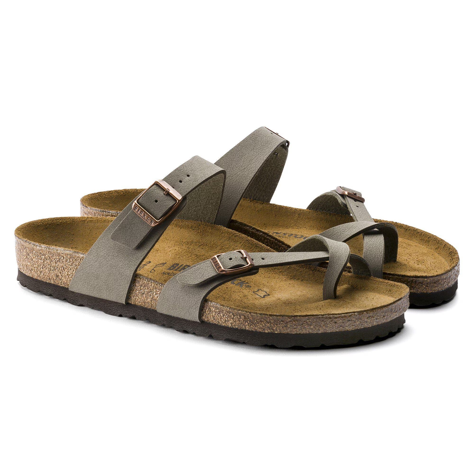 Pair of green sandals with cork insole on a white background