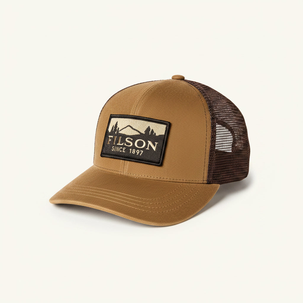 Brown trucker cap with Filson logo on a white background