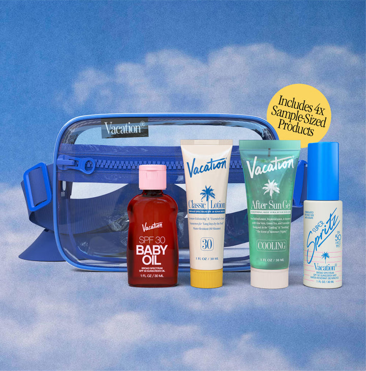 Collection of 'Vacation' brand skincare and sun care products with a blue bag against a cloudy sky background.