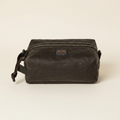 Brown waxed canvas dopp kit with Filson logo on a white background