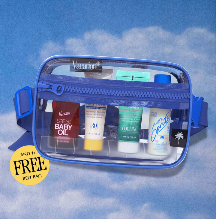 Clear travel bag with blue zipper against a cloudy sky background