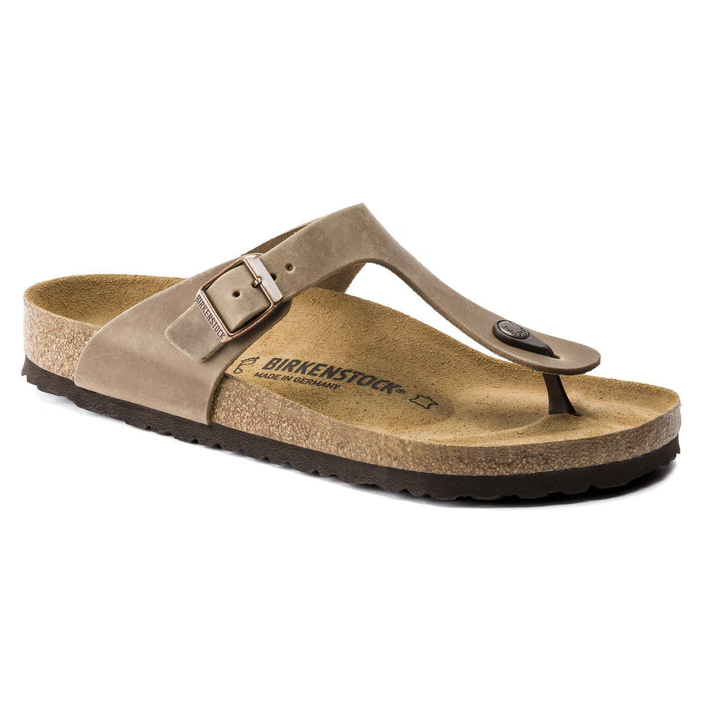 Brown sandal with a strap on a white background