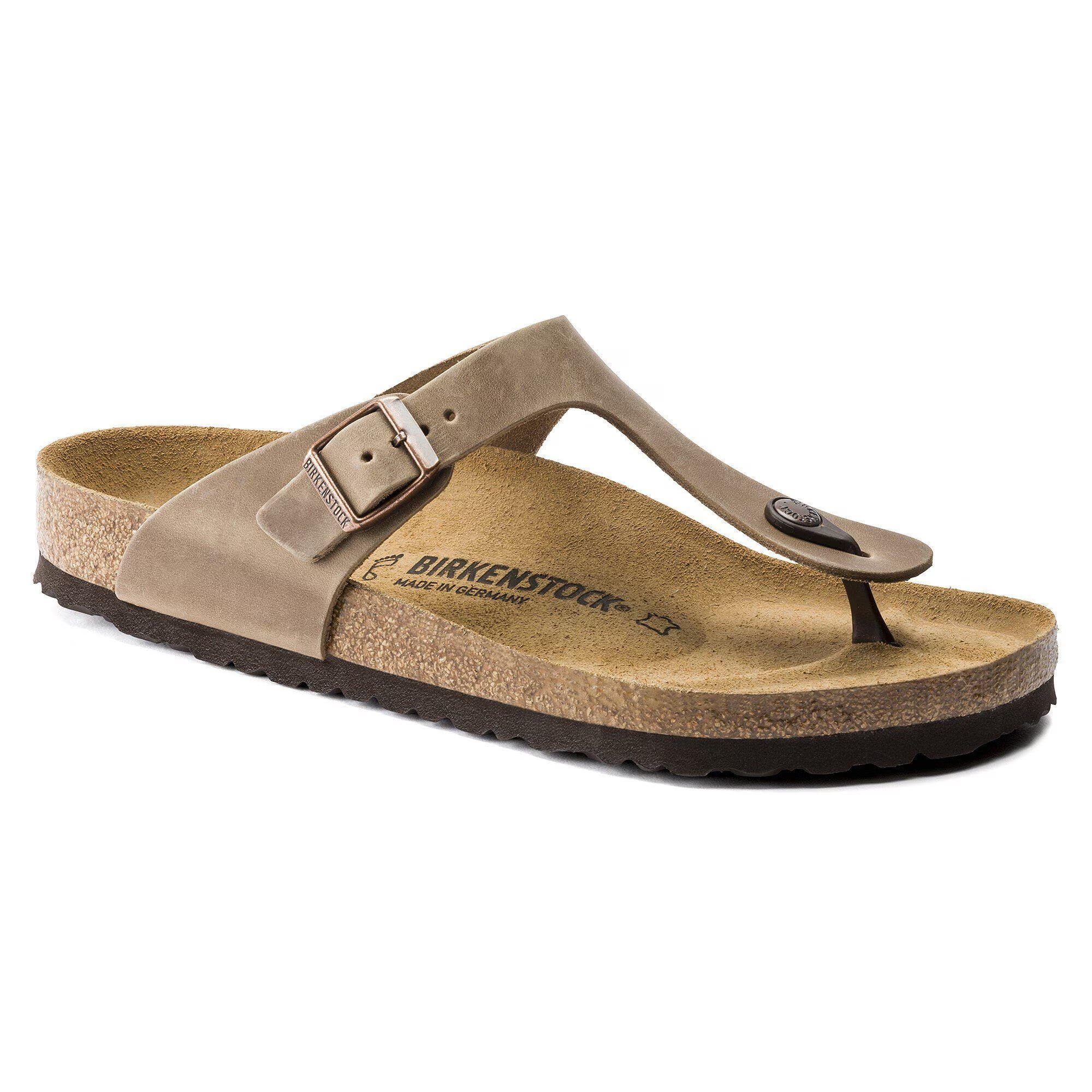 Brown sandal with a strap on a white background
