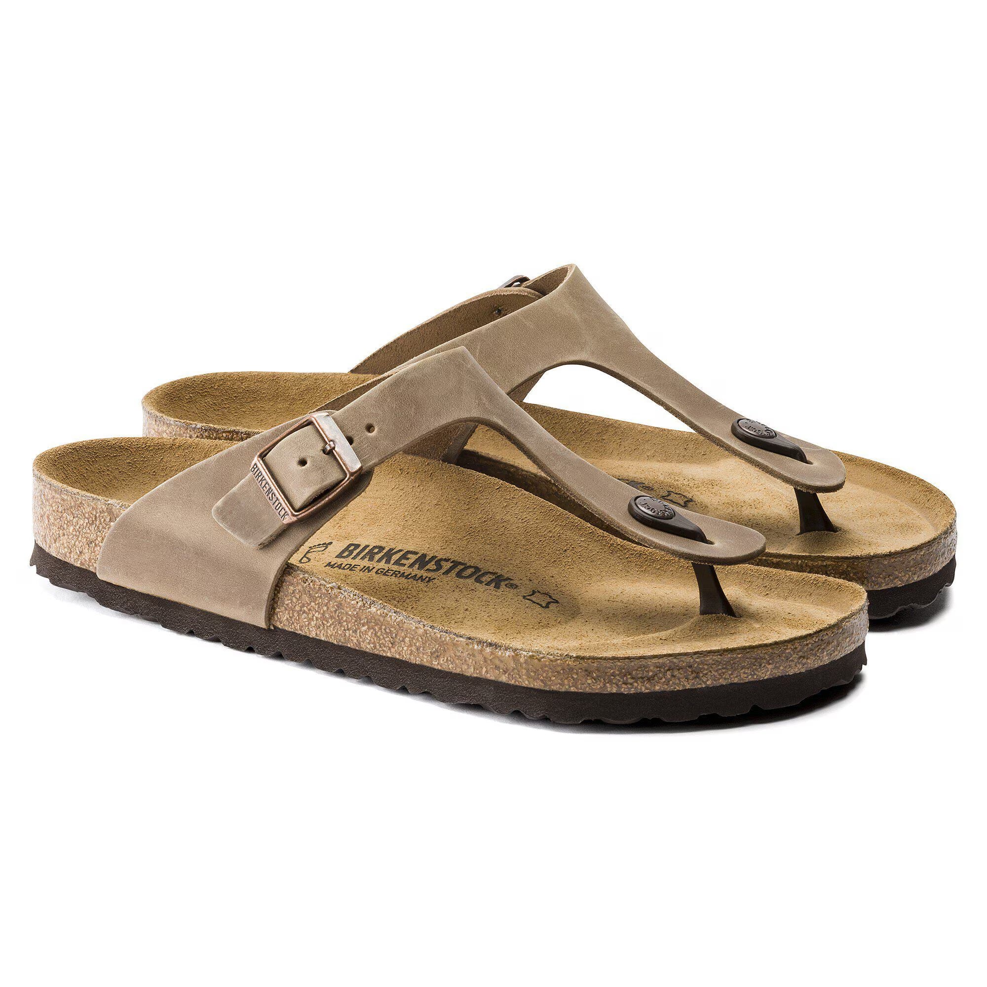 Pair of brown Birkenstock sandals on a white background