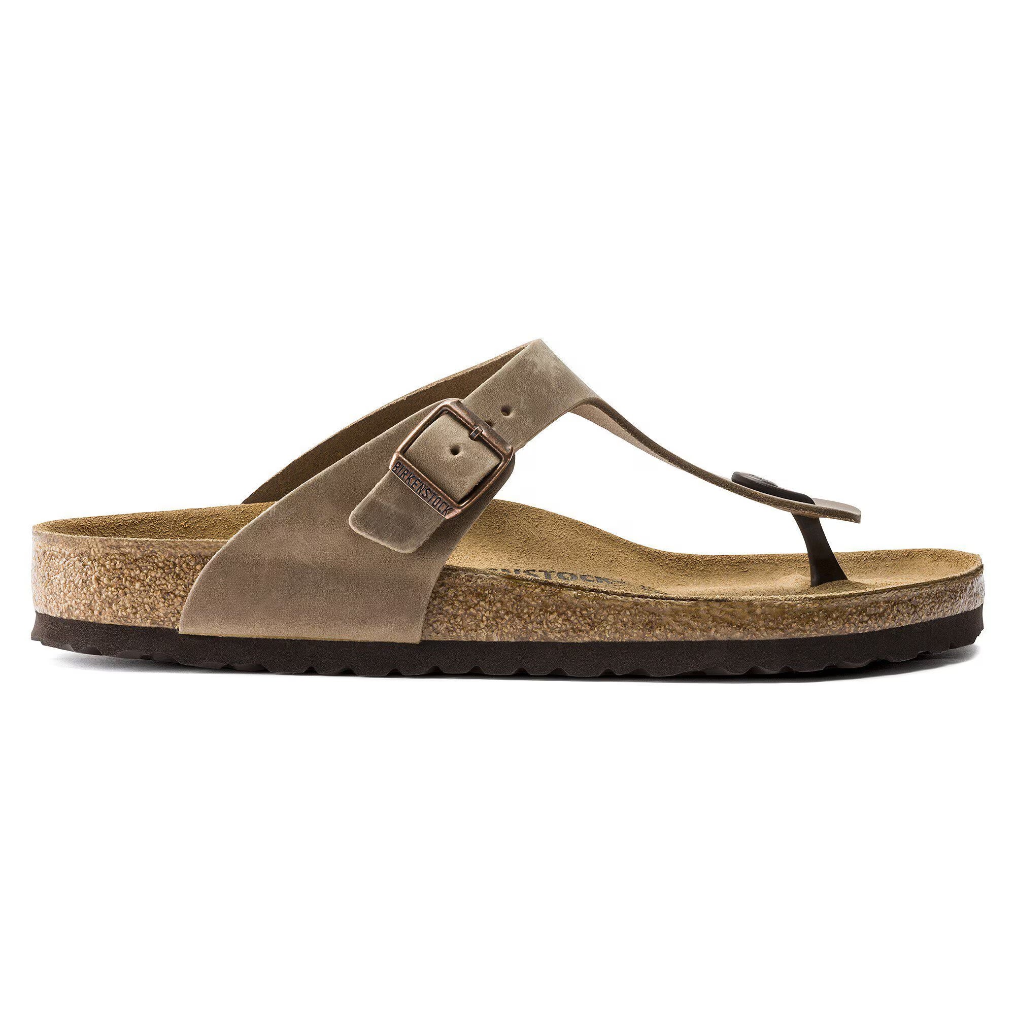 Brown sandal with a strap on a white background