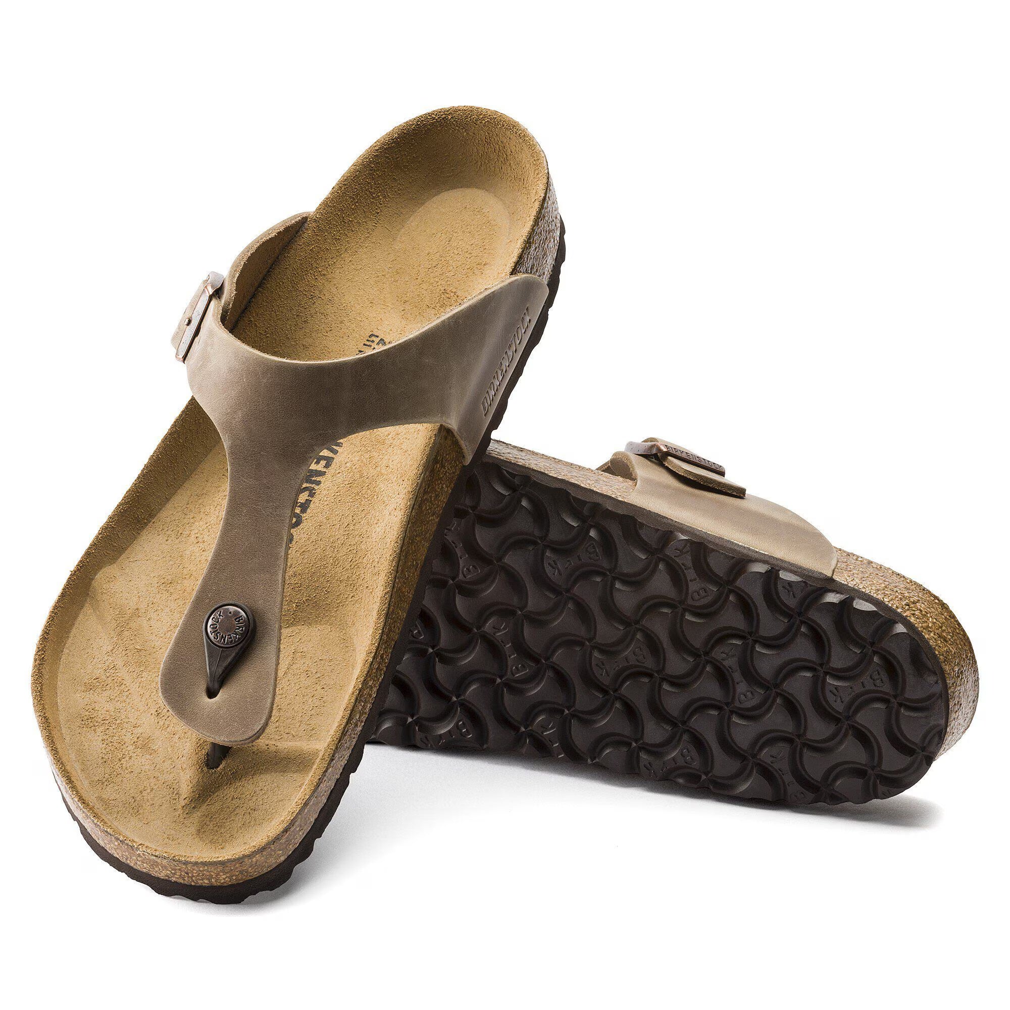 Pair of brown sandals with textured sole on a white background