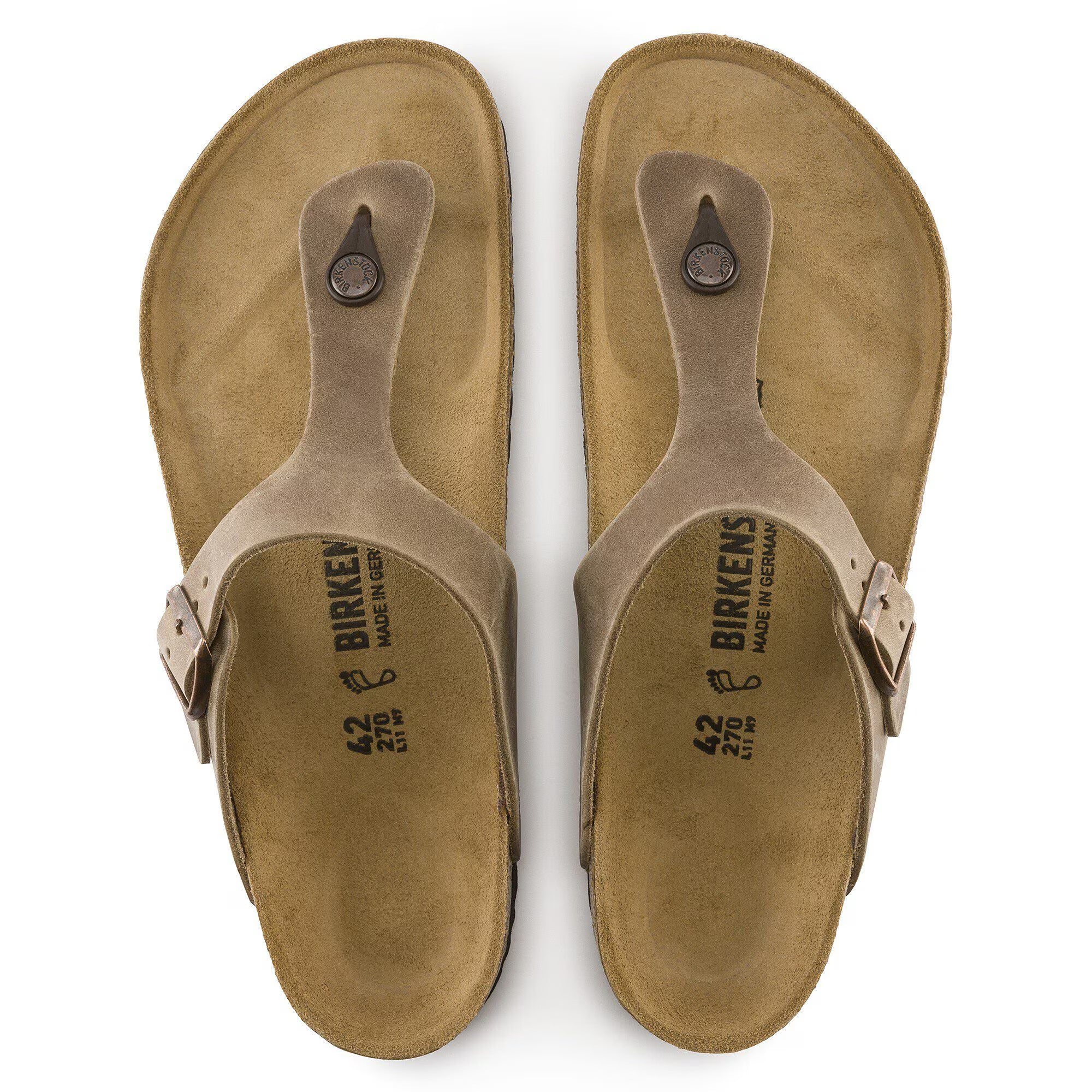 Pair of tan sandals with 'Birkenstock' branding on a white background