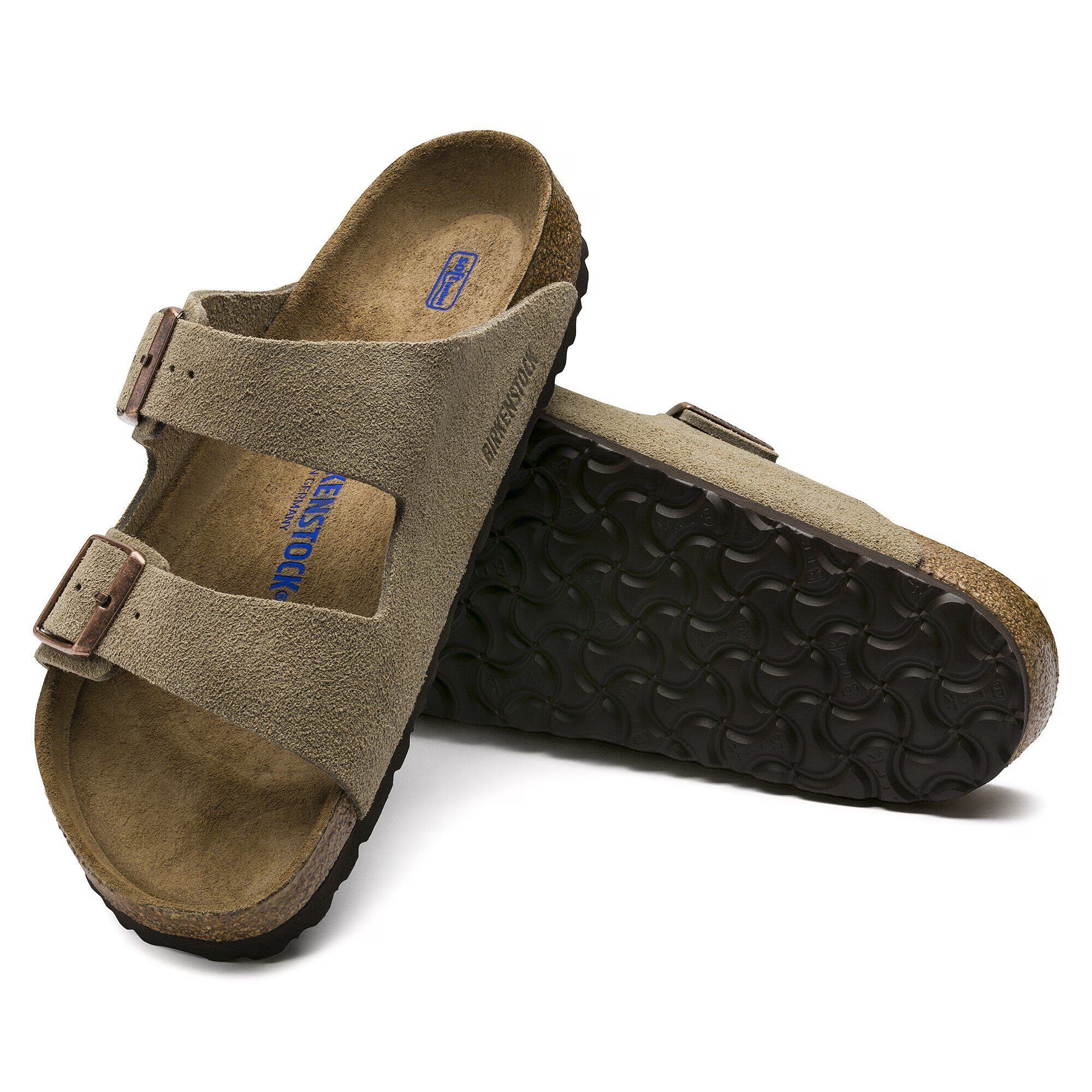 Pair of brown sandals with a visible brand logo on a white background