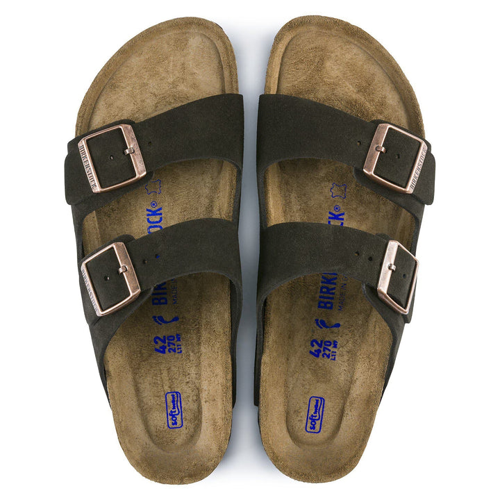 Pair of brown sandals with buckles on a white background
