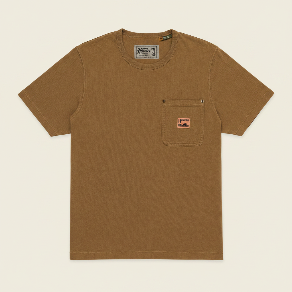 A brown short-sleeve crewneck pocket t-shirt by Hester, featuring a small orange brand patch on the chest pocket, displayed flat against a solid black background.