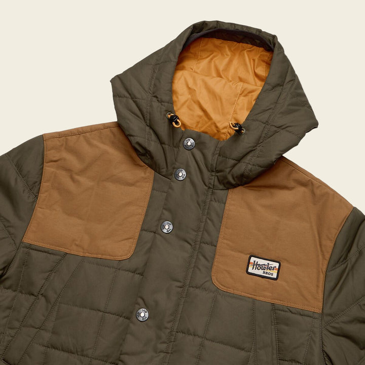Brown and tan quilted jacket with a brand logo on a white background