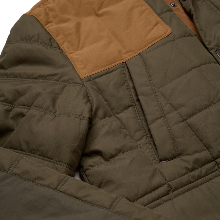 Close-up of a quilted jacket with brown interior lining