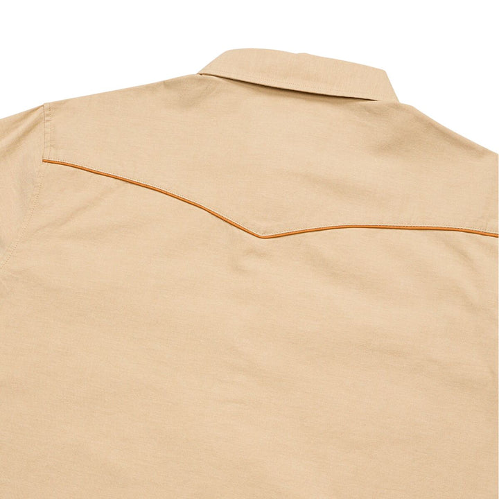 Beige shirt with brown stitching on a white background