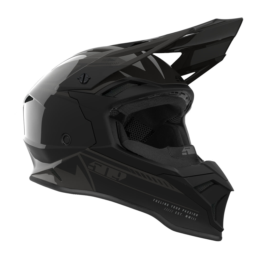 Black motocross helmet with visor on a white background