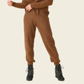 Brown tracksuit with black boots on a white background