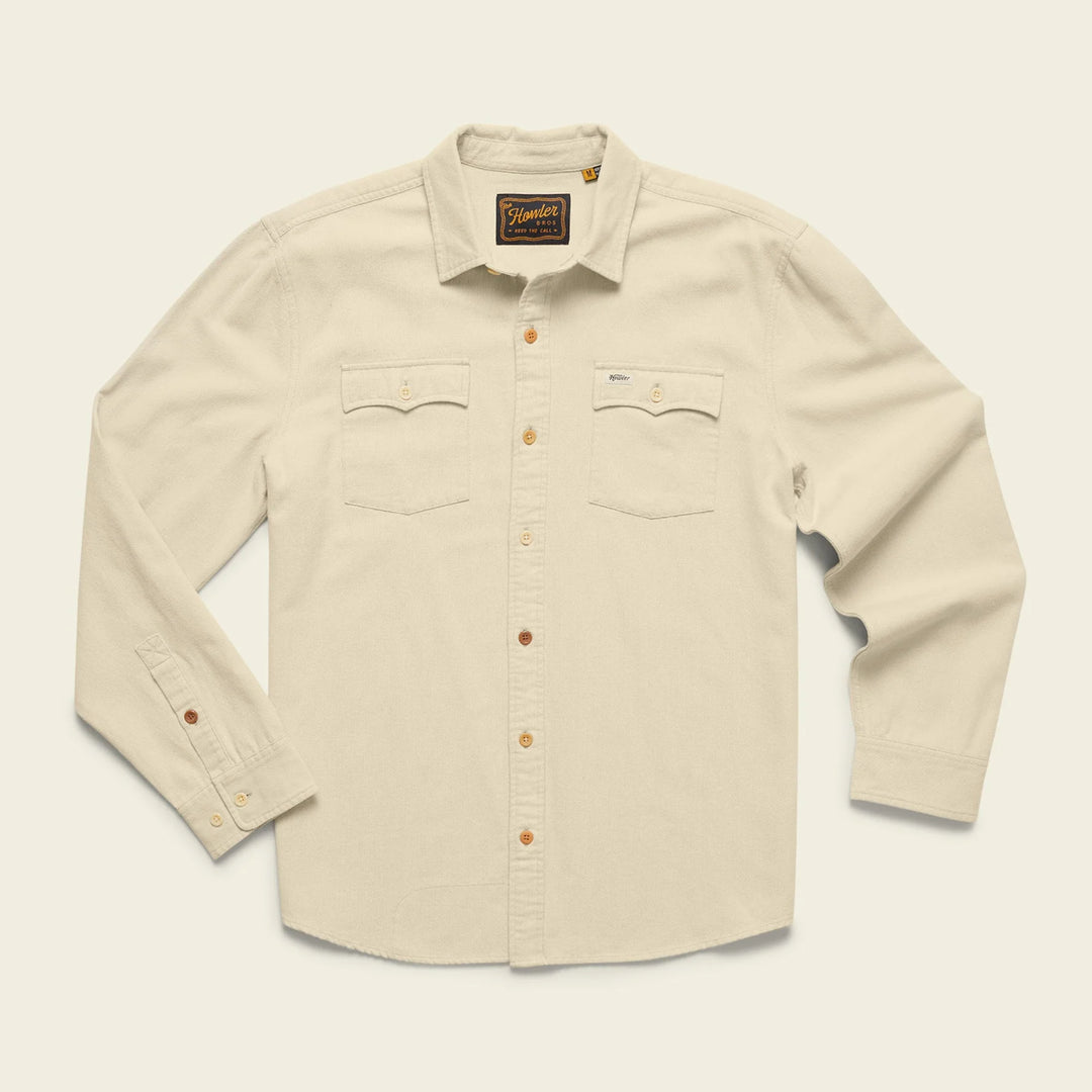 Beige shirt with button details on a light beige background
